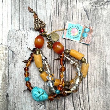 Afrikaanse armband in geel & oranje met Turquoise @ StyleTrash.nl